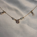 Raindrop & floral drop crystals invisible necklace