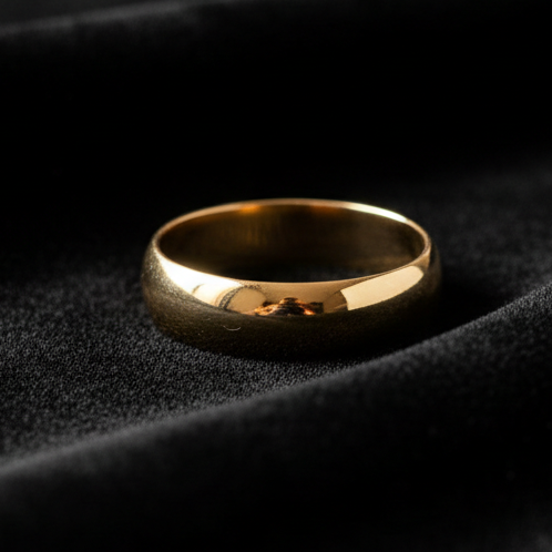 generate a realistic image of a gold ring on black velvet cloth